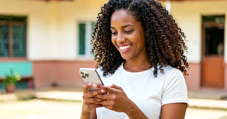 Young teacher receiving a job notification on her phone
