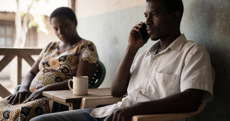 Applicant handling an INSS disability pension application by phone