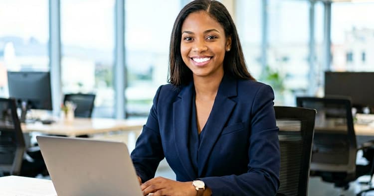Mozambican banking professional in an office working on a computer