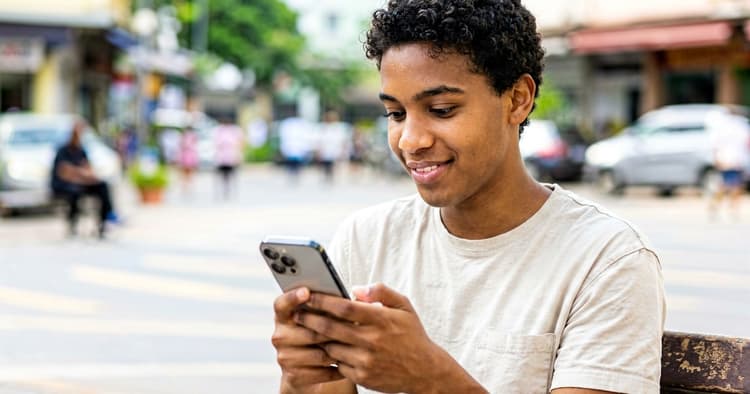 Young person receiving a new job notification on their phone