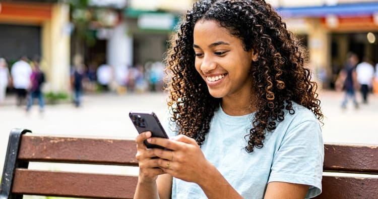 Young person receiving a job notification on their phone