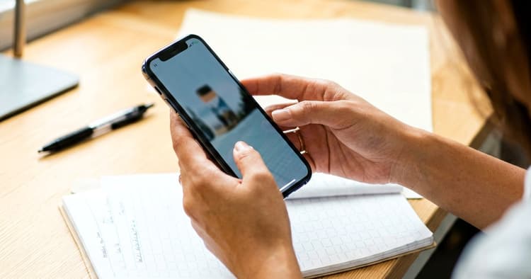 Person confirming professional references on a mobile phone