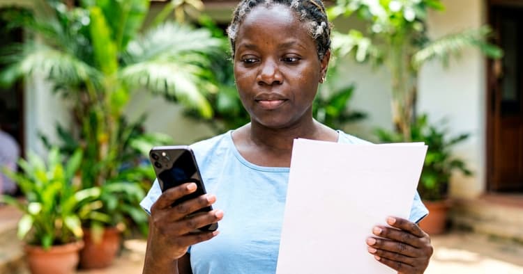 female applicant checking application documents on her mobile phone